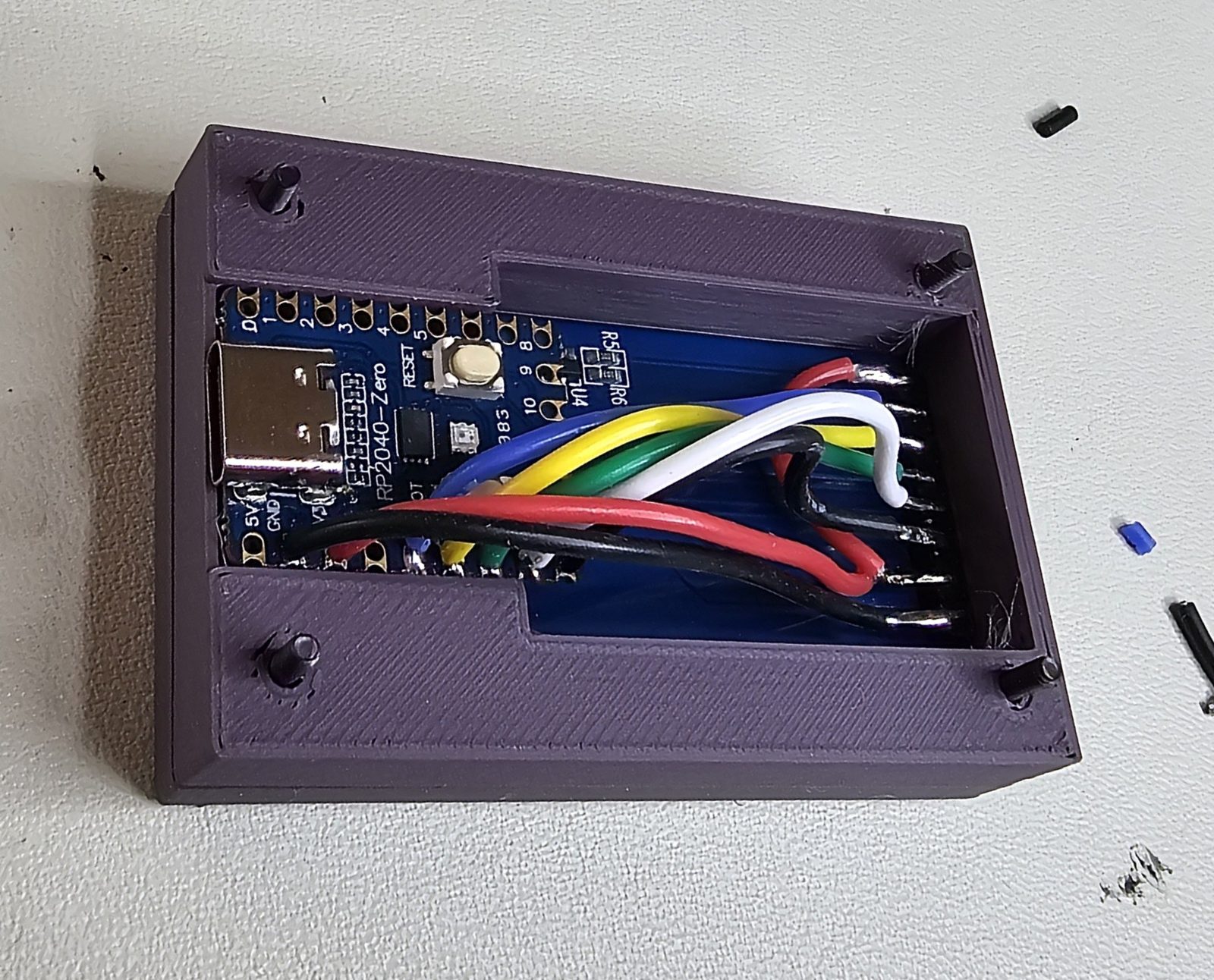 RP2040-Zero seated in the same enclosure shell, wired to the display header.